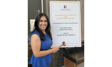 Senator Suzette Valladares in front of CJAC sign